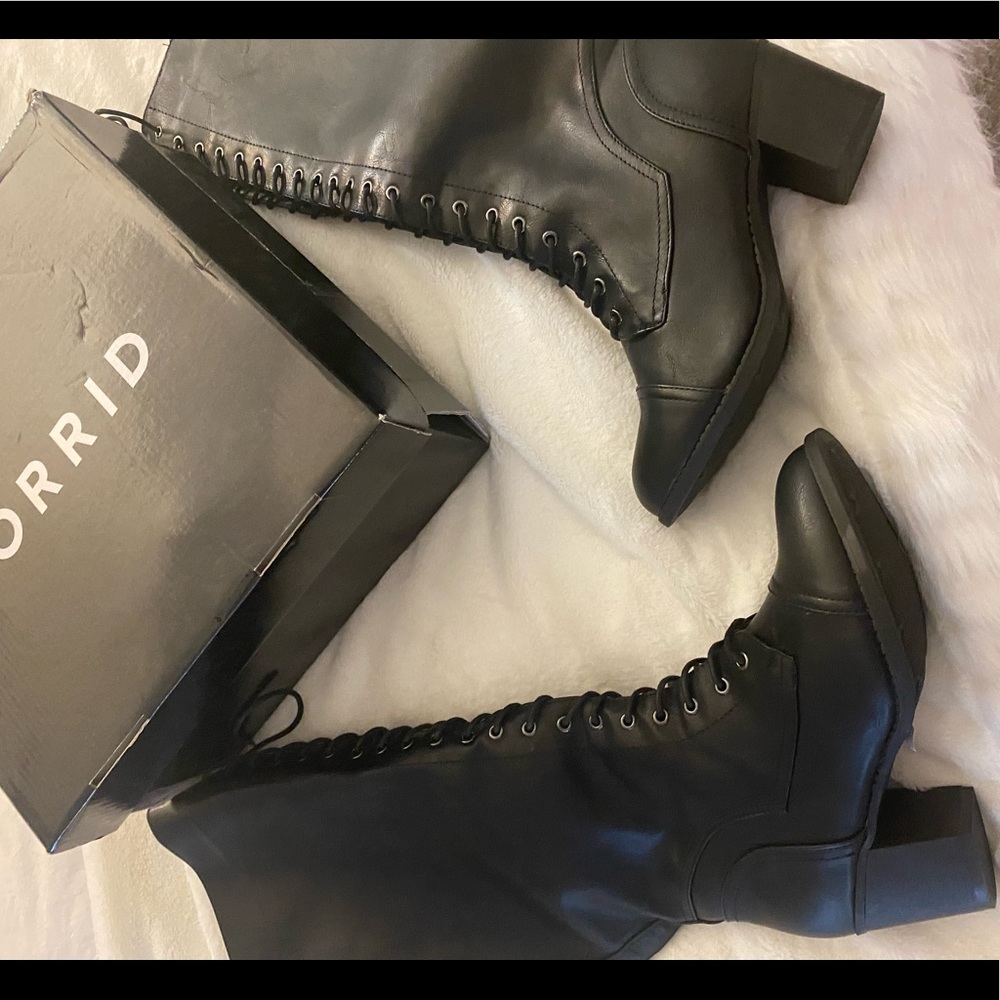 Brand new tall lace up extend calf black boots.